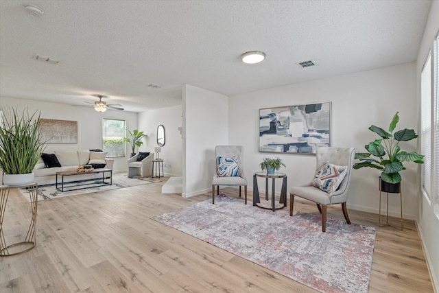 3300 Jacobs Dr, Mckinney, TX 75070 - living area with a textured ceiling, wood finished floors, and ceiling fan
