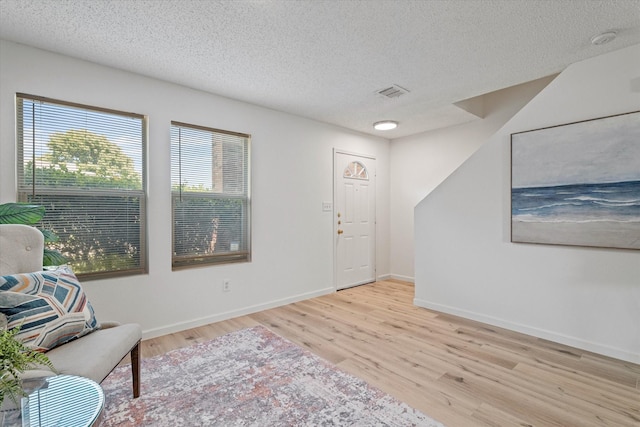 3300 Jacobs Dr, Mckinney, TX 75070 - sitting room featuring wood finished floors and a textured ceiling