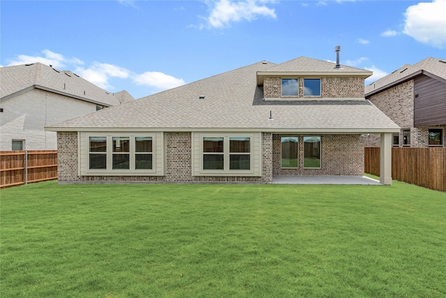 913 Cannes Dr, Red Oak, TX 75154 - rear view of house with a fenced backyard, a patio, brick siding, and roof with shingles