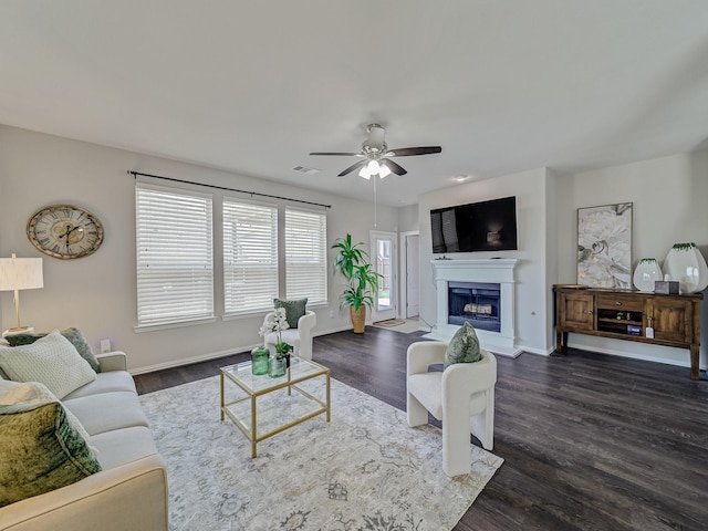 2460 Open Range Dr, Fort Worth, TX 76177 - living room with ceiling fan, dark wood-style flooring, and a fireplace with raised hearth