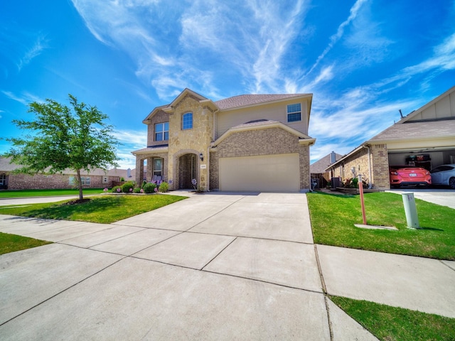 2460 Open Range Dr, Fort Worth, TX 76177 - view of front of home featuring brick siding, driveway, and a front lawn
