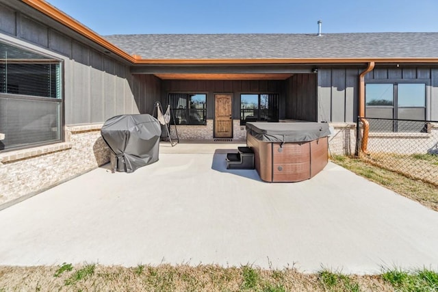217 Polk, Bowie, TX 76230 - view of patio featuring a hot tub and grilling area