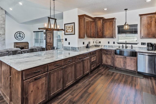 217 Polk, Bowie, TX 76230 - kitchen featuring stainless steel dishwasher, dark wood-type flooring, a peninsula, open floor plan, and light stone countertops