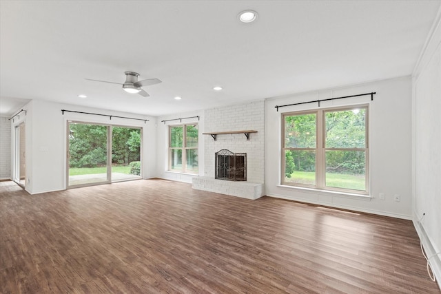 8620 S County Rd, Frisco, TX 75034 - unfurnished living room with a fireplace, ceiling fan, wood finished floors, and recessed lighting