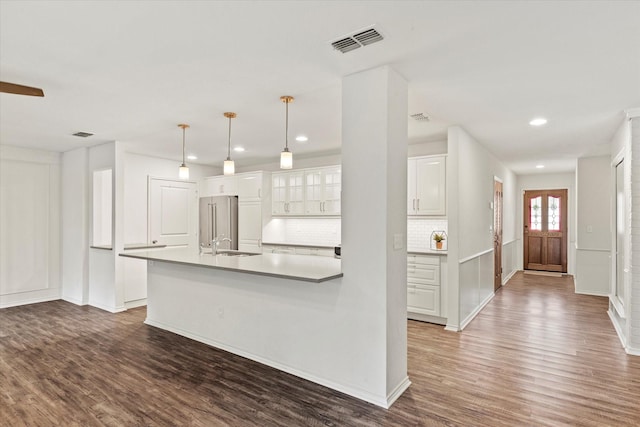 8620 S County Rd, Frisco, TX 75034 - kitchen featuring wood finished floors, decorative backsplash, white cabinets, recessed lighting, and pendant lighting