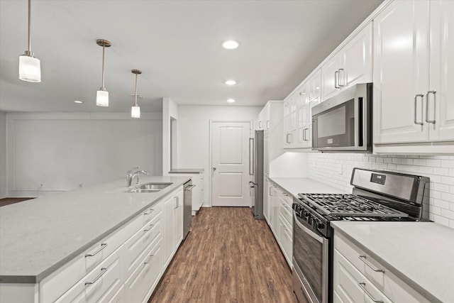 8620 S County Rd, Frisco, TX 75034 - kitchen with stainless steel appliances, recessed lighting, dark wood-style flooring, backsplash, and white cabinets