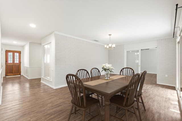 8620 S County Rd, Frisco, TX 75034 - dining room featuring brick wall, wood finished floors, and a chandelier
