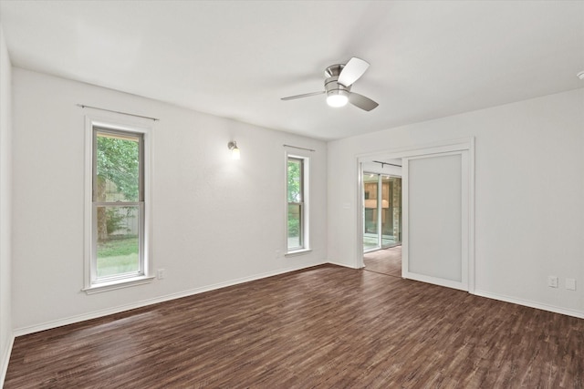 8620 S County Rd, Frisco, TX 75034 - unfurnished room featuring dark wood-style floors, plenty of natural light, and a ceiling fan