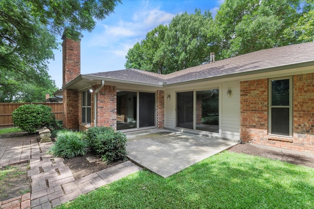 8620 S County Rd, Frisco, TX 75034 - back of property with a chimney, a patio, brick siding, and roof with shingles