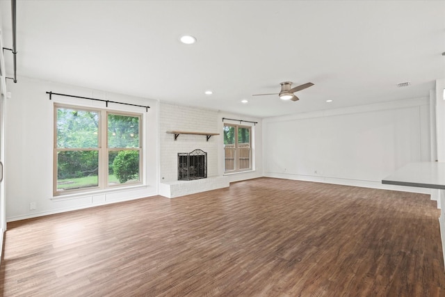 8620 S County Rd, Frisco, TX 75034 - unfurnished living room featuring ceiling fan, wood finished floors, a fireplace, and recessed lighting