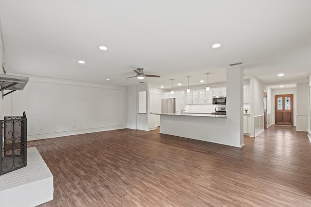 8620 S County Rd, Frisco, TX 75034 - unfurnished living room with recessed lighting, wood finished floors, and ceiling fan