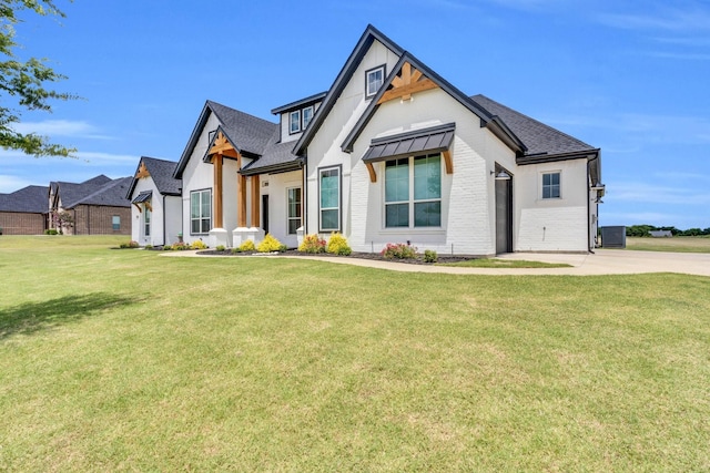 140 Friesian Ln, Waxahachie, TX 75167 - modern farmhouse style home featuring a front yard, roof with shingles, and brick siding