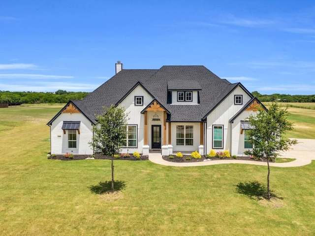 140 Friesian Ln, Waxahachie, TX 75167 - modern inspired farmhouse with a chimney, roof with shingles, a front yard, and board and batten siding