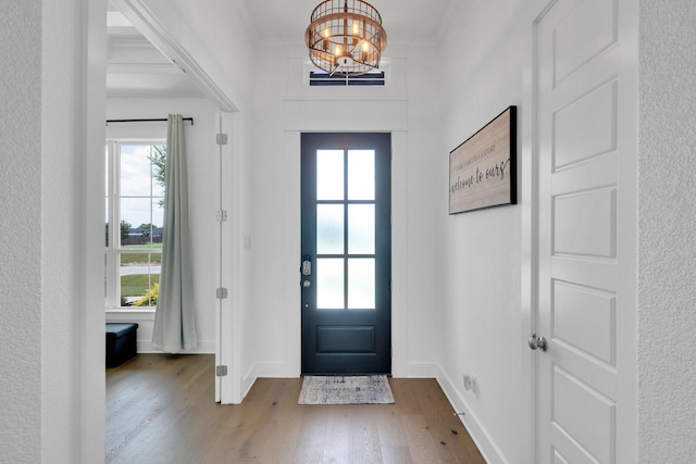 140 Friesian Ln, Waxahachie, TX 75167 - foyer featuring plenty of natural light, a chandelier, and wood finished floors