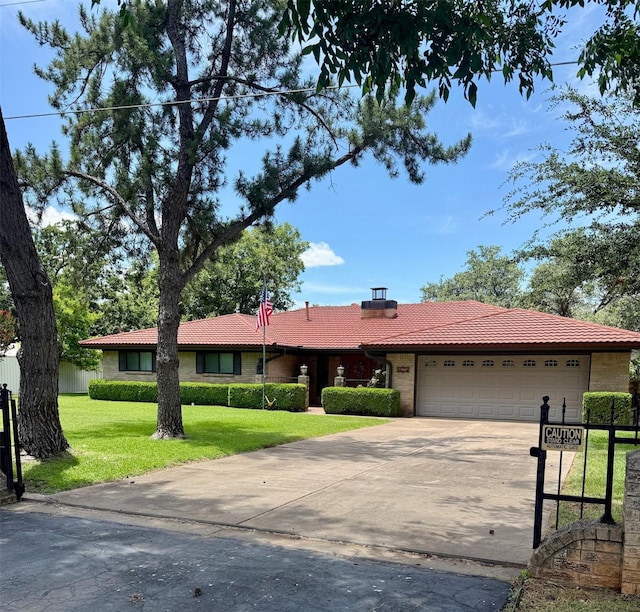 3093 County Road 264, Breckenridge, TX 76424 - ranch-style house with a tile roof, an attached garage, and driveway