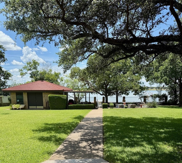 3093 County Road 264, Breckenridge, TX 76424 - view of front of house featuring a front yard and a tile roof