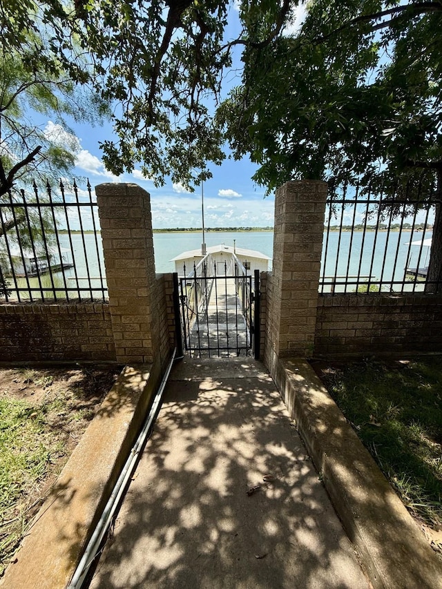 3093 County Road 264, Breckenridge, TX 76424 - gate with a water view