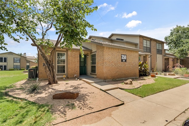 350 W Harwood Rd Unit A, Hurst, TX 76054 - view of front facade featuring brick siding and a front lawn