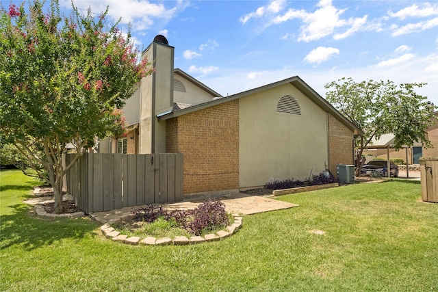 350 W Harwood Rd Unit A, Hurst, TX 76054 - view of home's exterior with brick siding and a chimney