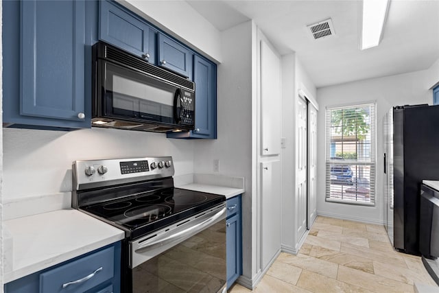 350 W Harwood Rd Unit A, Hurst, TX 76054 - kitchen with stainless steel appliances, blue cabinetry, light countertops, and light stone finish flooring