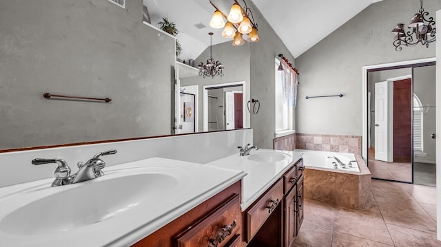 5613 Buttercup Ln, Mckinney, TX 75070 - bathroom featuring a chandelier, vaulted ceiling, double vanity, a garden tub, and tile patterned floors