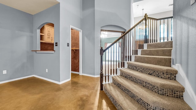 5613 Buttercup Ln, Mckinney, TX 75070 - stairs with finished concrete flooring and arched walkways