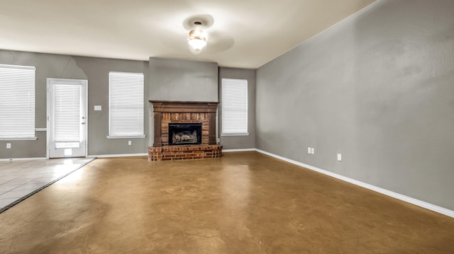 5613 Buttercup Ln, Mckinney, TX 75070 - unfurnished living room with a fireplace and concrete flooring
