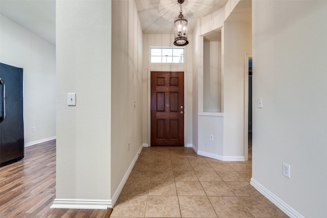 2836 Fordham Rd, Plano, TX 75025 - entryway featuring a chandelier and baseboards