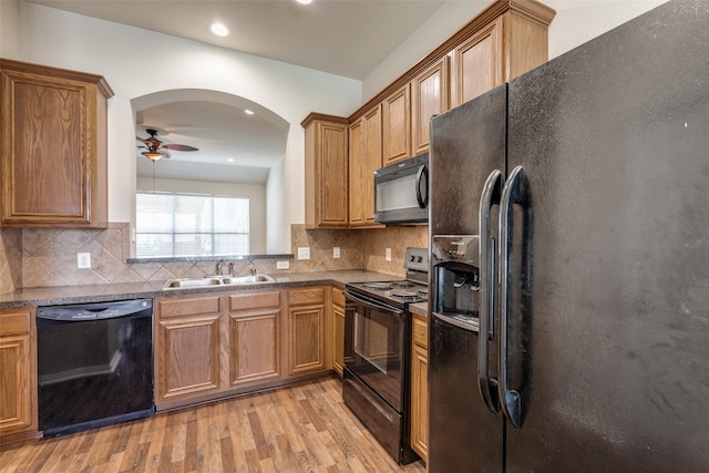 2836 Fordham Rd, Plano, TX 75025 - kitchen featuring black appliances, light wood-type flooring, a ceiling fan, dark countertops, and brown cabinets