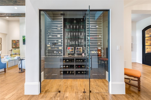 2307 Cedar Elm Ter, Westlake, TX 76262 - wine room featuring wood finished floors and arched walkways