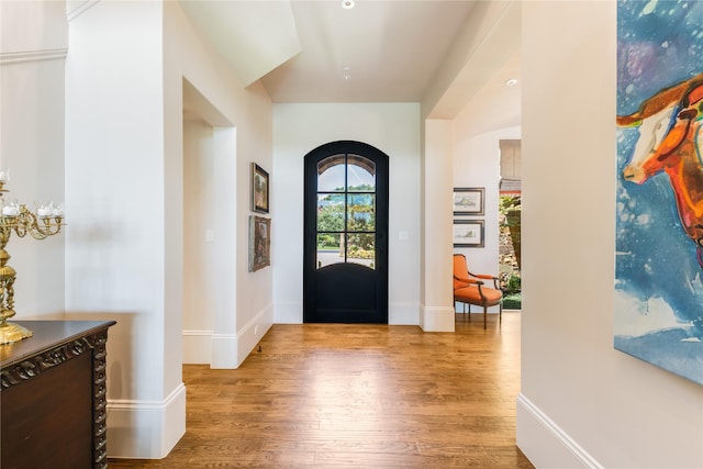 2307 Cedar Elm Ter, Westlake, TX 76262 - foyer featuring wood finished floors, arched walkways, and recessed lighting