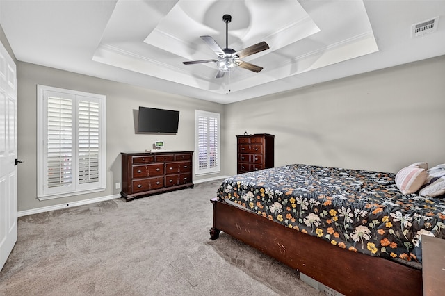 218 Bryant St, Pottsboro, TX 75076 - carpeted bedroom featuring a tray ceiling, ornamental molding, and a ceiling fan