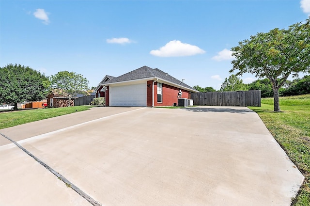 218 Bryant St, Pottsboro, TX 75076 - view of side of property featuring brick siding, driveway, and an attached garage