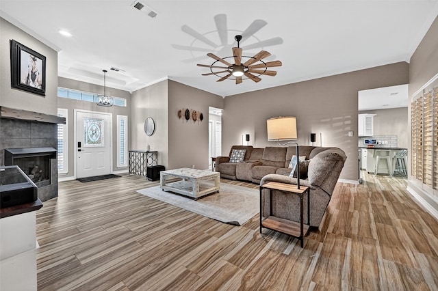 218 Bryant St, Pottsboro, TX 75076 - living room featuring wood finished floors, crown molding, ceiling fan, a fireplace, and recessed lighting