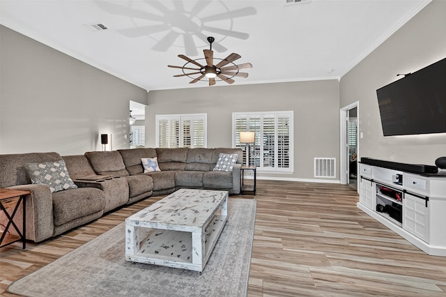 218 Bryant St, Pottsboro, TX 75076 - living area featuring ceiling fan, ornamental molding, and light wood-style flooring