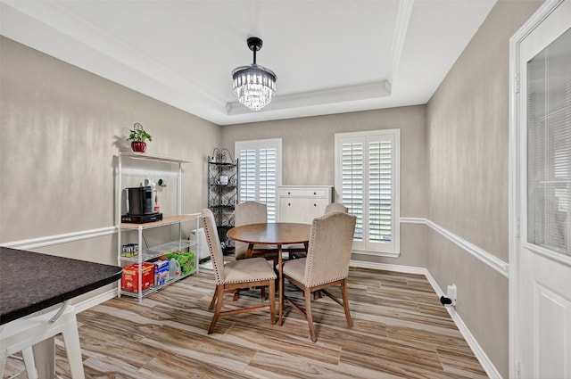 218 Bryant St, Pottsboro, TX 75076 - dining area featuring a raised ceiling, a chandelier, and wood finished floors