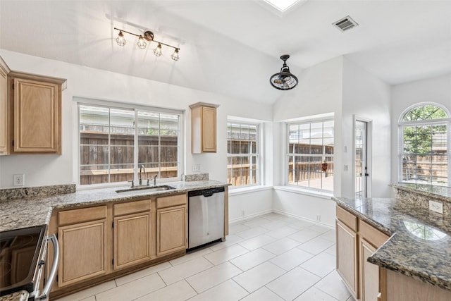 10412 Harris Ct, Irving, TX 75063 - kitchen with stainless steel appliances, lofted ceiling, light tile patterned floors, and stone countertops