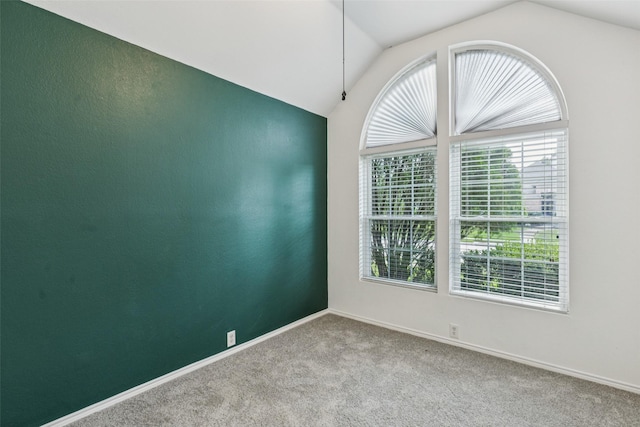 10412 Harris Ct, Irving, TX 75063 - carpeted spare room featuring lofted ceiling and baseboards