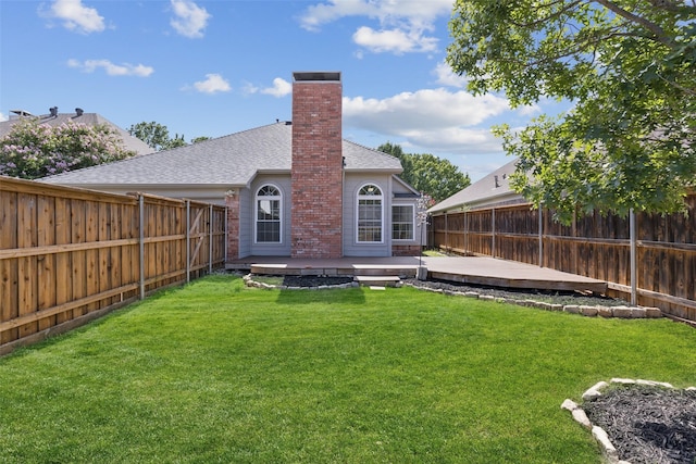 10412 Harris Ct, Irving, TX 75063 - back of property featuring a chimney, a fenced backyard, a shingled roof, and a patio