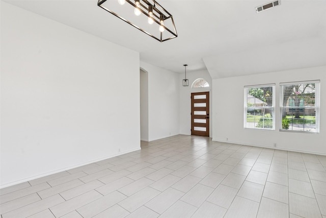 10412 Harris Ct, Irving, TX 75063 - spare room featuring a chandelier and baseboards