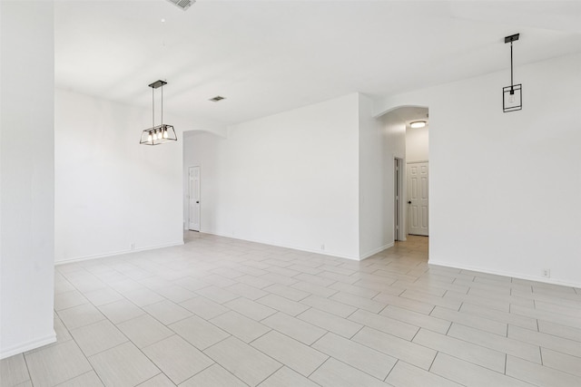 10412 Harris Ct, Irving, TX 75063 - spare room featuring arched walkways and light tile patterned floors