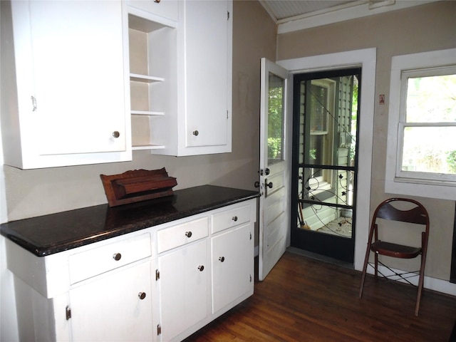 319 W Baylor St, Weatherford, TX 76086 - kitchen with open shelves, white cabinets, dark countertops, and dark wood finished floors