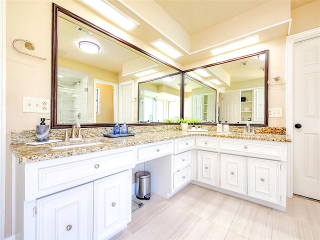 2219 Timberwood, Carrollton, TX 75006 - bathroom with double vanity and a shower stall