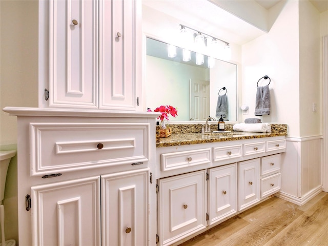 2219 Timberwood, Carrollton, TX 75006 - bathroom featuring vanity and wood finished floors