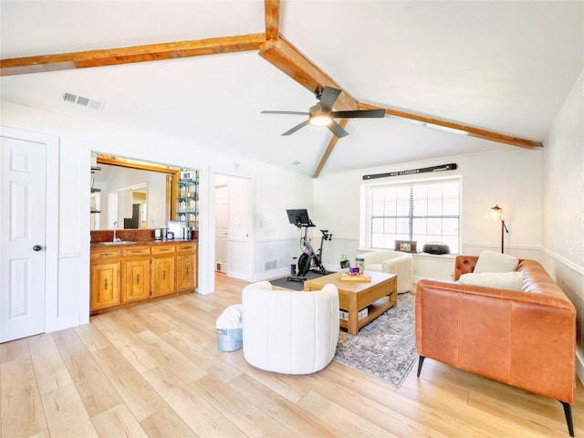 2219 Timberwood, Carrollton, TX 75006 - living area with light wood finished floors, ceiling fan, and a wainscoted wall