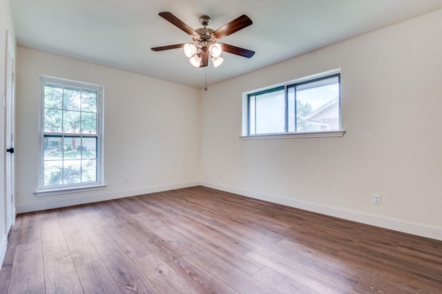 1020 Peach Ln, Desoto, TX 75115 - unfurnished room with wood finished floors and a ceiling fan
