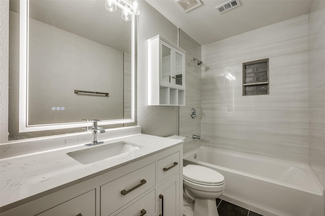 7851 Quiet Meadow Ln, Frisco, TX 75033 - bathroom with tub / shower combination, vanity, a textured wall, and tile patterned floors