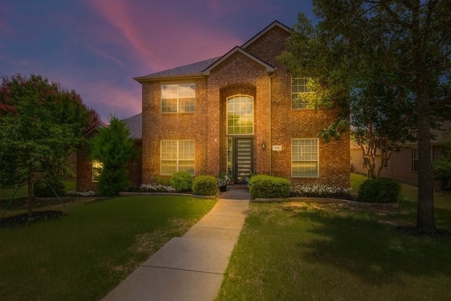 7851 Quiet Meadow Ln, Frisco, TX 75033 - traditional home featuring brick siding and a lawn