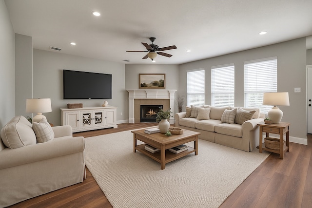 7851 Quiet Meadow Ln, Frisco, TX 75033 - living room featuring a ceiling fan, dark wood-style flooring, recessed lighting, and a fireplace