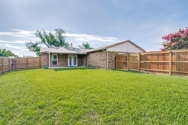 1913 Northwind Ct, Garland, TX 75040 - rear view of property with brick siding, a fenced backyard, and french doors
